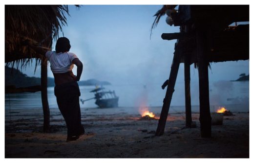 A Moken woman stares out to sea. 