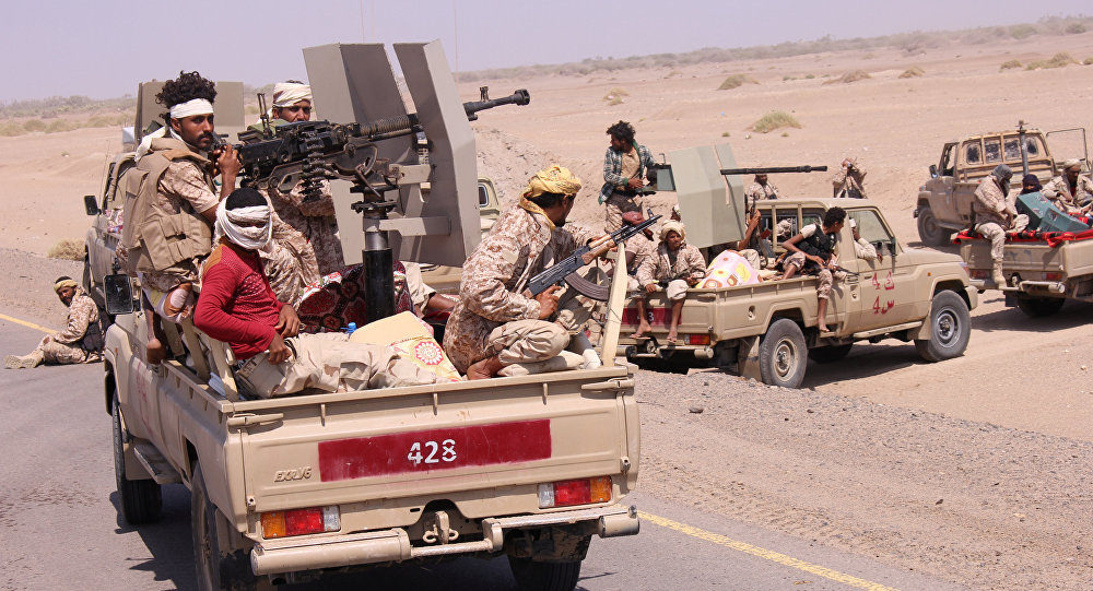 Members of the Yemeni army ride on the back of military trucks near the Red Sea coast city of al-Mokha, Yemen, January 23, 2017