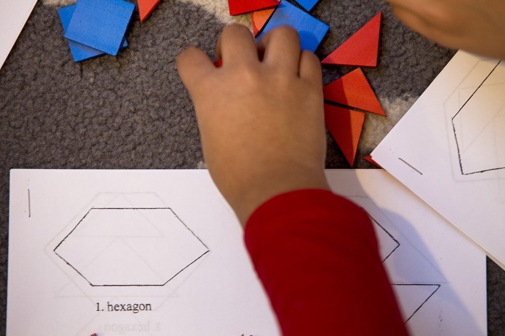 Click to enlarge Students do geometric shape puzzles