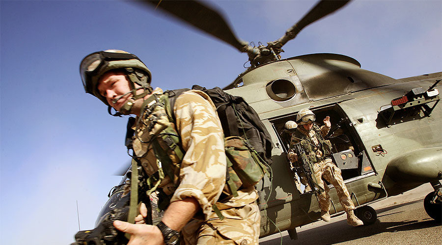 British soldiers jump out of a helicopter 