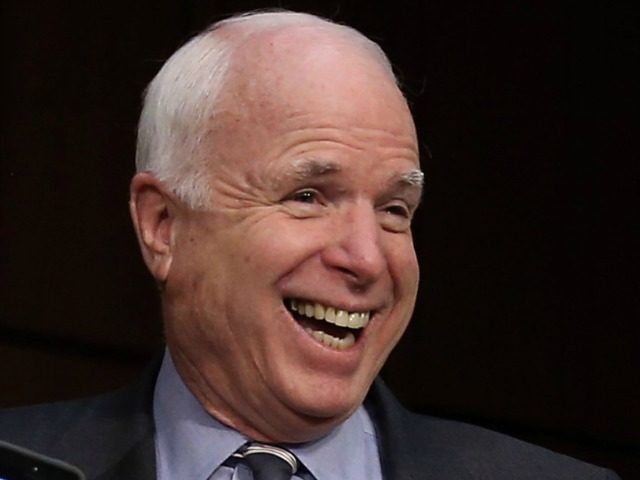 Click to enlarge McCain laughing
