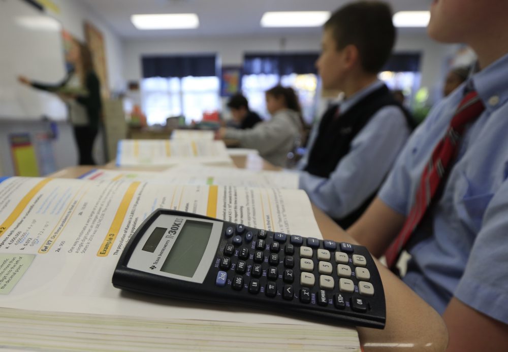 student with calculator