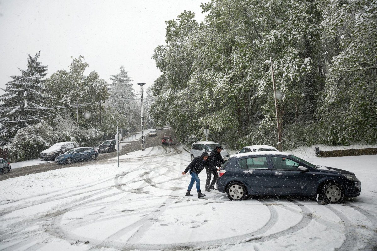 Click to enlarge A car stuck in April snow in District XII.