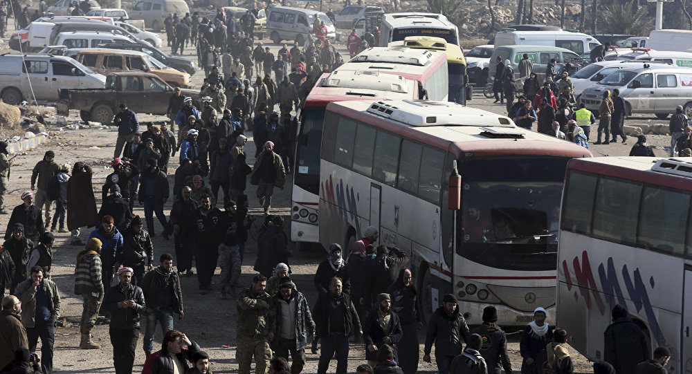 Syrians evacuated from the embattled Syrian city of Aleppo during the ceasefire arrive at a refugee camp in Rashidin, near Idlib, Syria, early Monday, Dec. 19, 2016