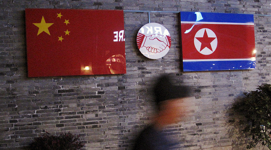 China and N. Korea flags