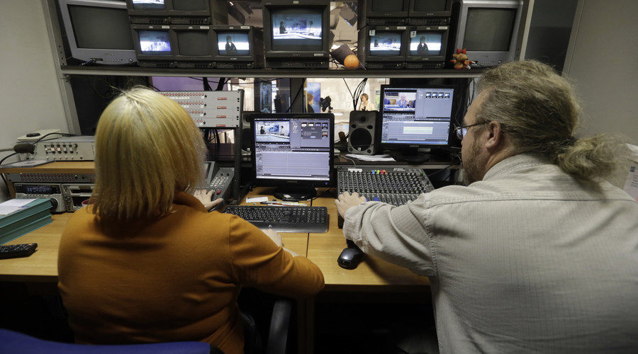 Click to enlarge Russian-language Pervy Baltiysky Kanal (PBK) news program directors supervise a broadcast in Riga