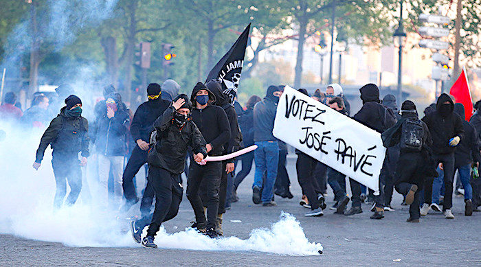 Click to enlarge Paris rioters smoke grenades