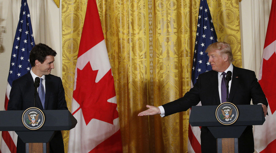 Justin Trudeau (L) is greeted by Donald Trump