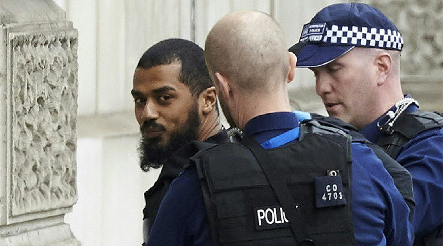 Click to enlarge British police detain a man
