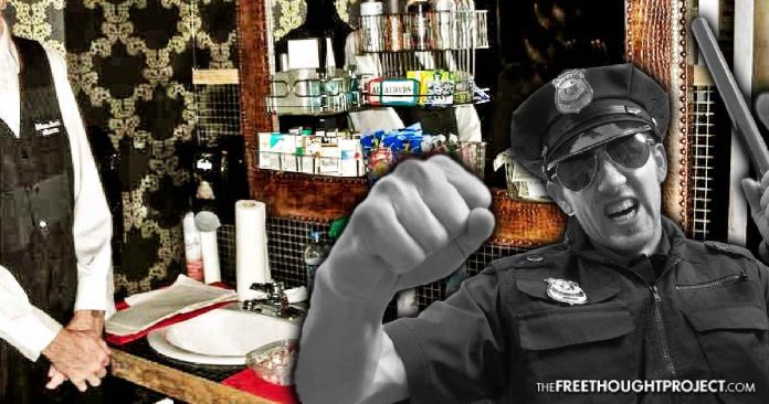 cop hits bathroom attendant