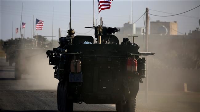 Click to enlarge This file photo taken on March 5, 2017 shows a convoy of US forces armored vehicles on the western outskirts of the northern Syrian city of Manbij