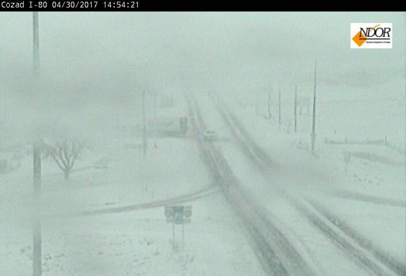 Click to enlarge April 30th, 2017 spring storm drops snow near Cozad, NE. This is a look near I-80 and Highway 21.