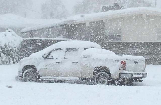 Click to enlarge A truck is seen in the snow Sunday morning on a Garden City, Kan., street.