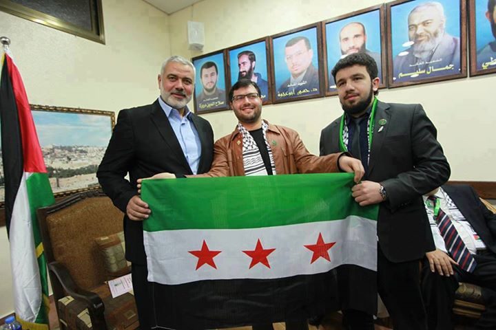 Click to enlarge Hamas leader Khaled Mashal holding the flag of the Turkish funded, Syrian based terrorist group FSA