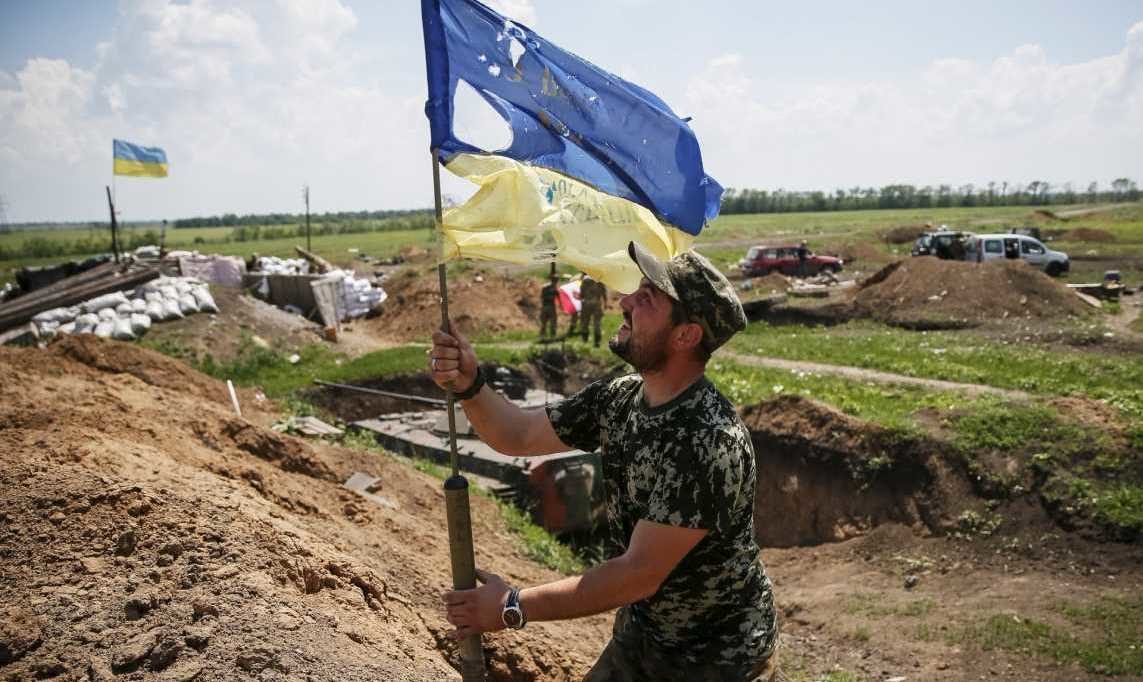 soldier holding flag