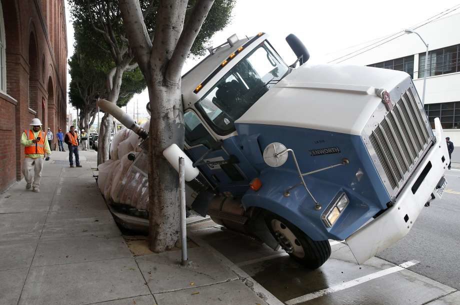 A sinkhole partially consumes a large truck parked on 7th Street near Townsend Street in San Francisco, Calif. on Friday, May 5, 2017.