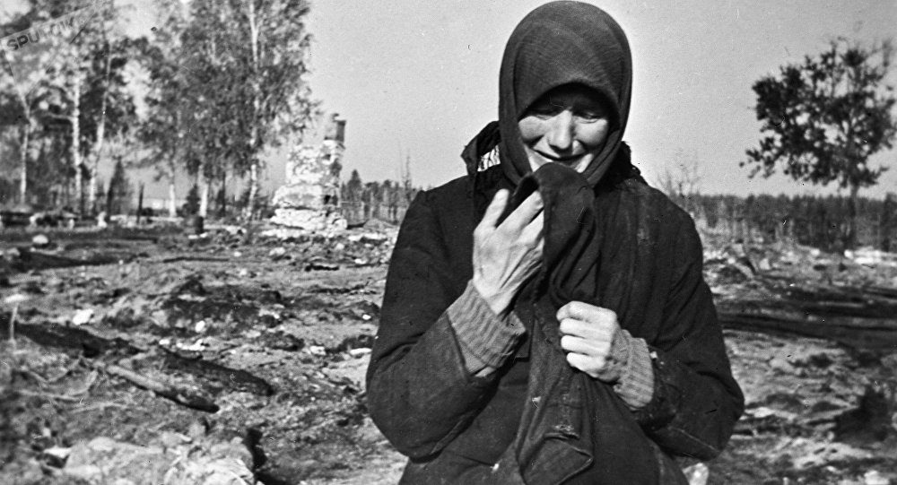 Woman weeping at Nazi destroyed village during WWII