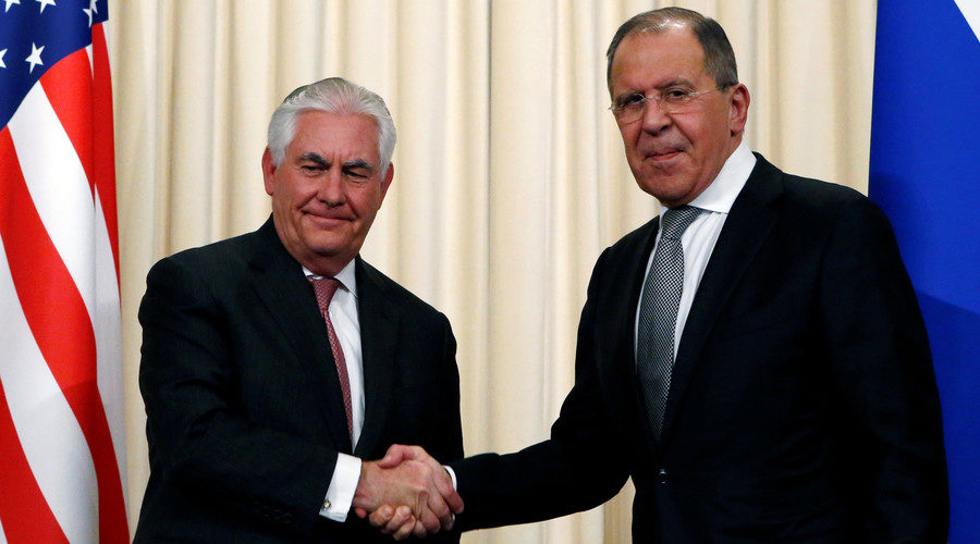 Sergei Lavrov shakes hands with Rex Tillerson
