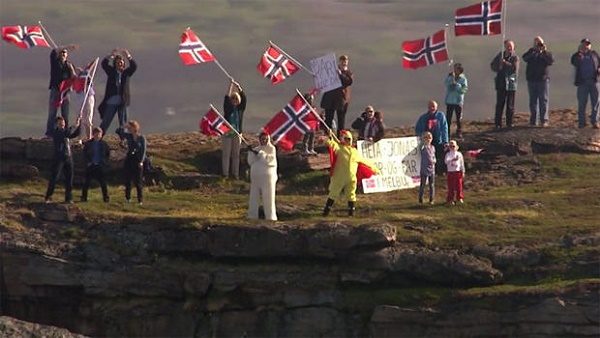 Click to enlarge Well-wishers greet the arrival of the cruise ship
