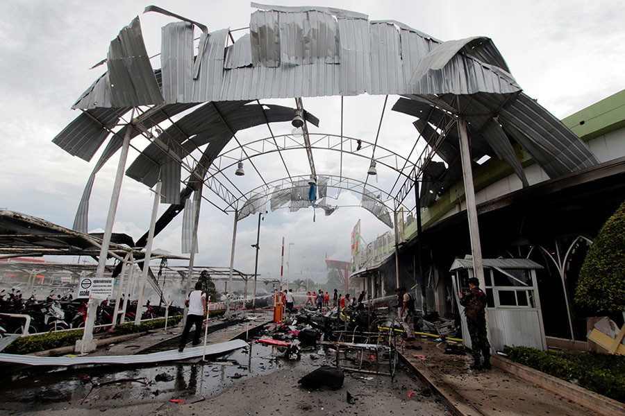 Click to enlarge blast site is seen outside a supermarket in Pattani
