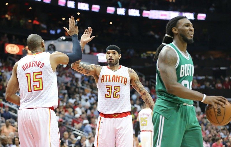Click to enlarge Hawks’ Mike Scott (center)