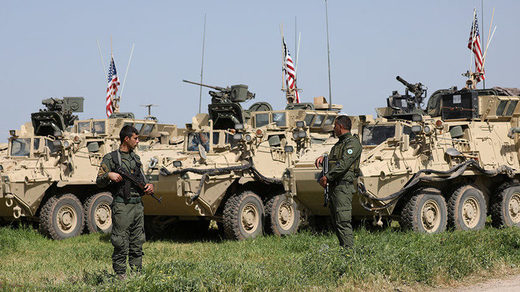 Click to enlarge YPG stand near U.S military vehicles