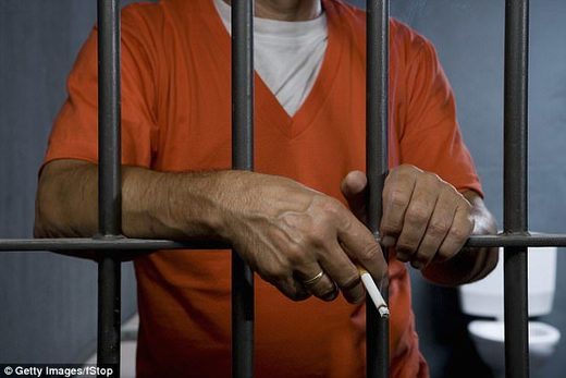 UK inmate smoking a cigarette