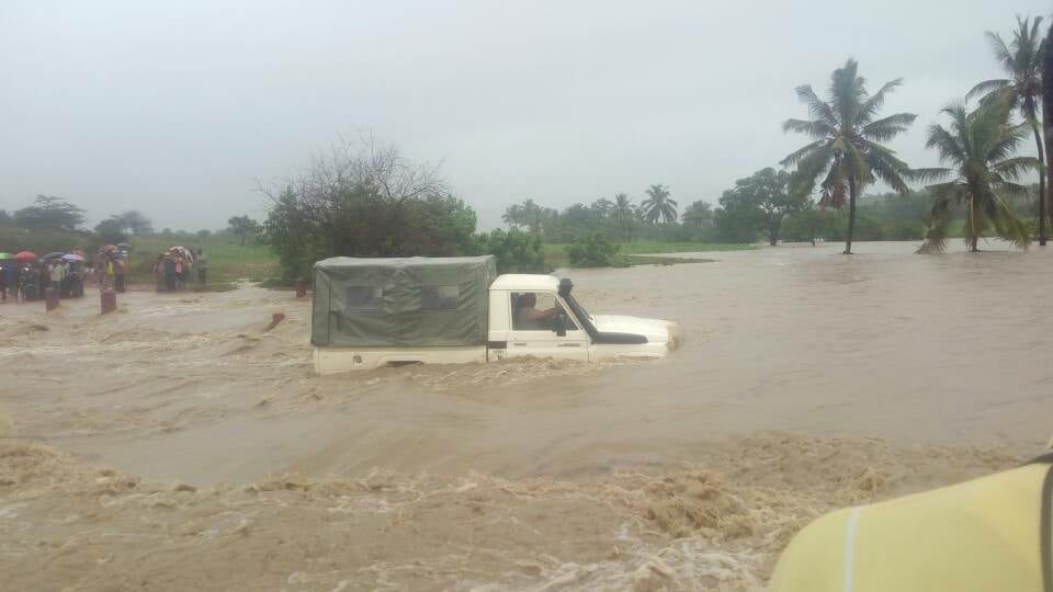 Click to enlarge The flooding Mbadi River.