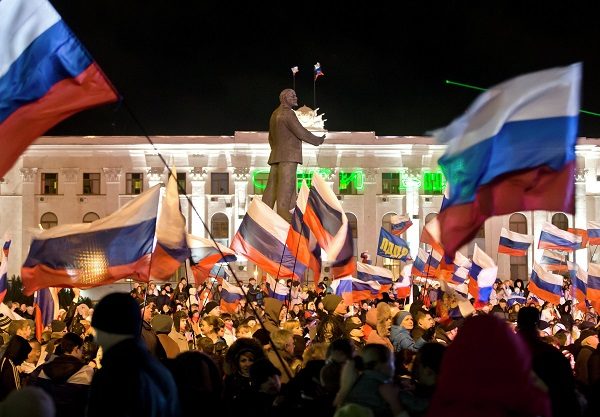 Pro-Russian people celebrate in Lenin Square, in Simferopol, Ukraine, Sunday, March 16, 2014.