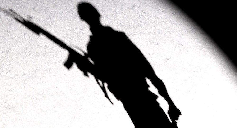 silhouette of man with gun