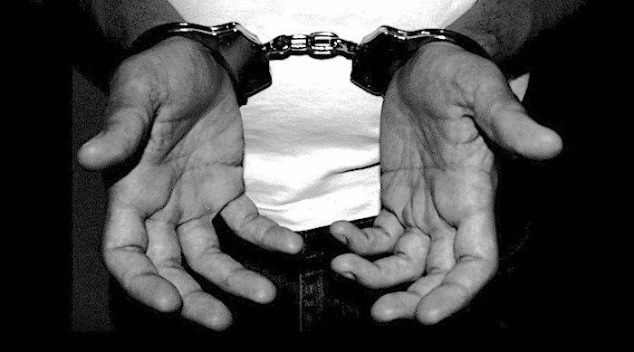 Click to enlarge shackled hands