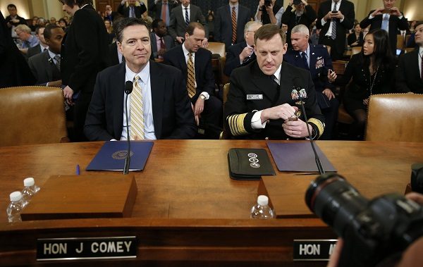Click to enlarge James Comey (L) and Mike Rogers