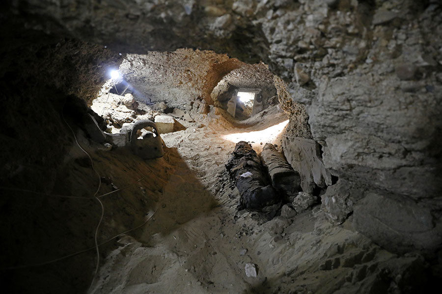 Click to enlarge mummy inside the newly discovered burial site in Minya, Egypt