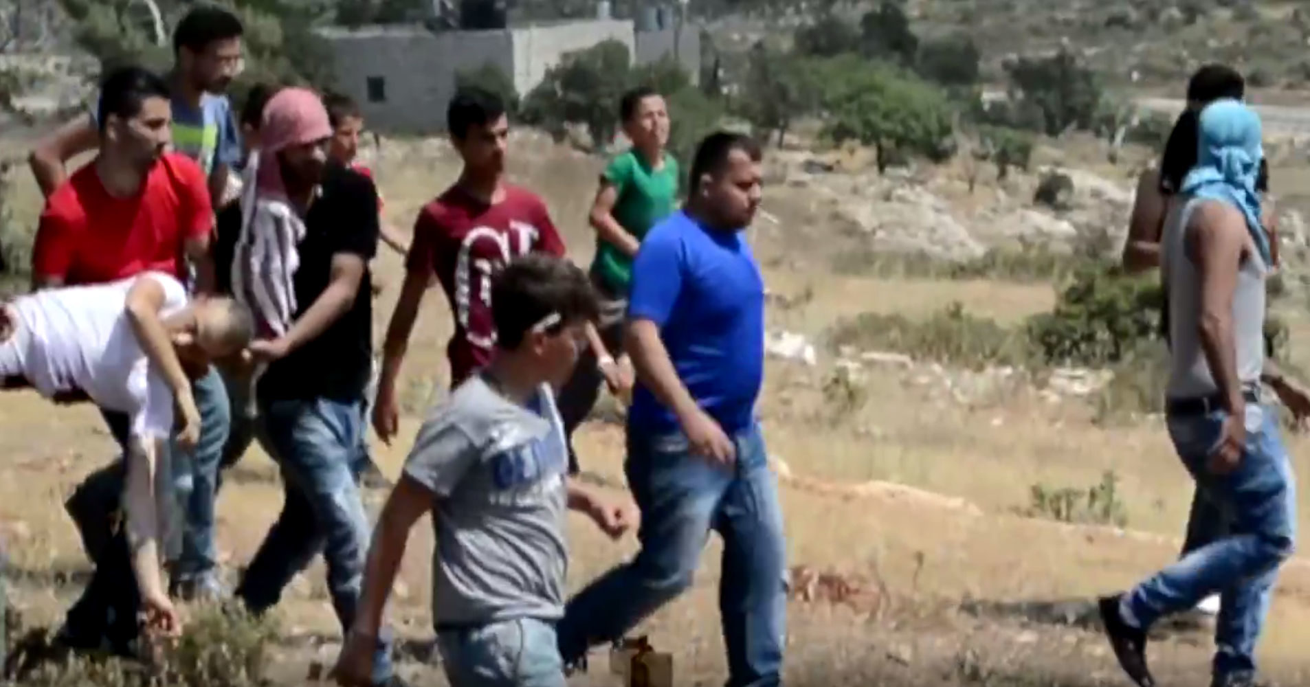 Click to enlarge Saba Obaid carried after he was shot in Nabi Saleh