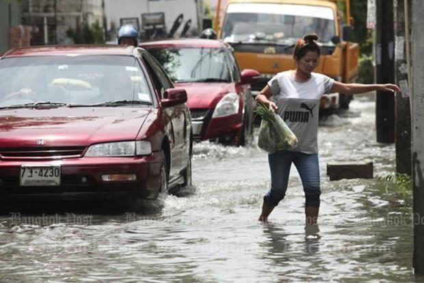 Flooded roads and heavy traffic is a major inconvenience for pedestrians as well as motorists. 