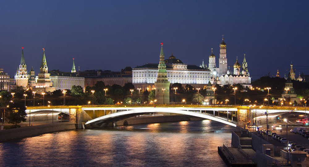 The Kremlin and Bolshoy Kamenny Bridge are at night in Moscow