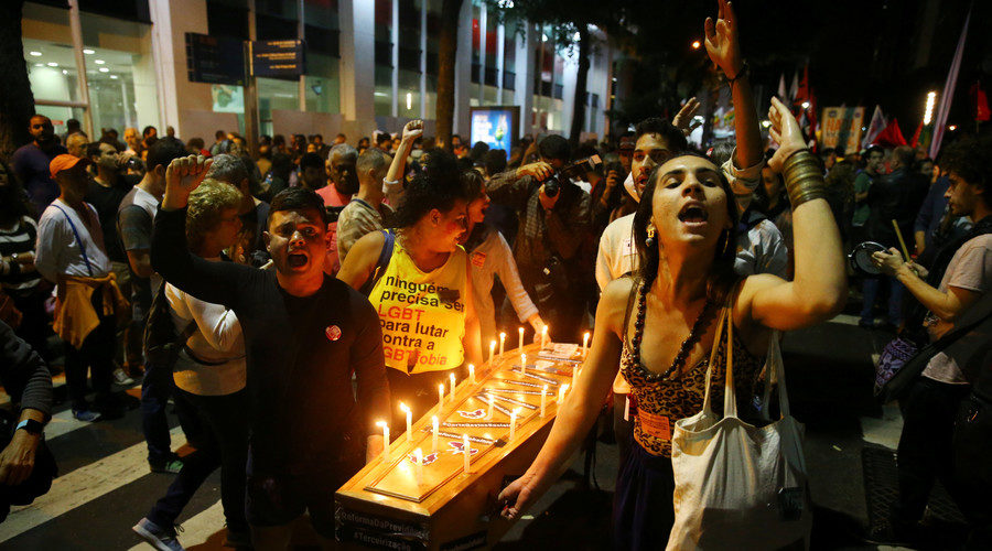 Click to enlarge Demonstrators carry a coffin during a protest against Brazil's President Michel Temer