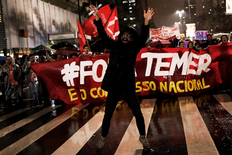 Click to enlarge Demonstrators take part in a protest against Brazil's President Michel Temer
