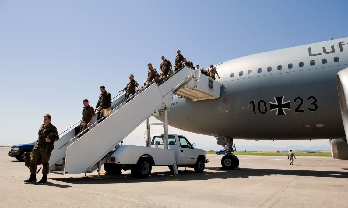 German soldiers exiting plane