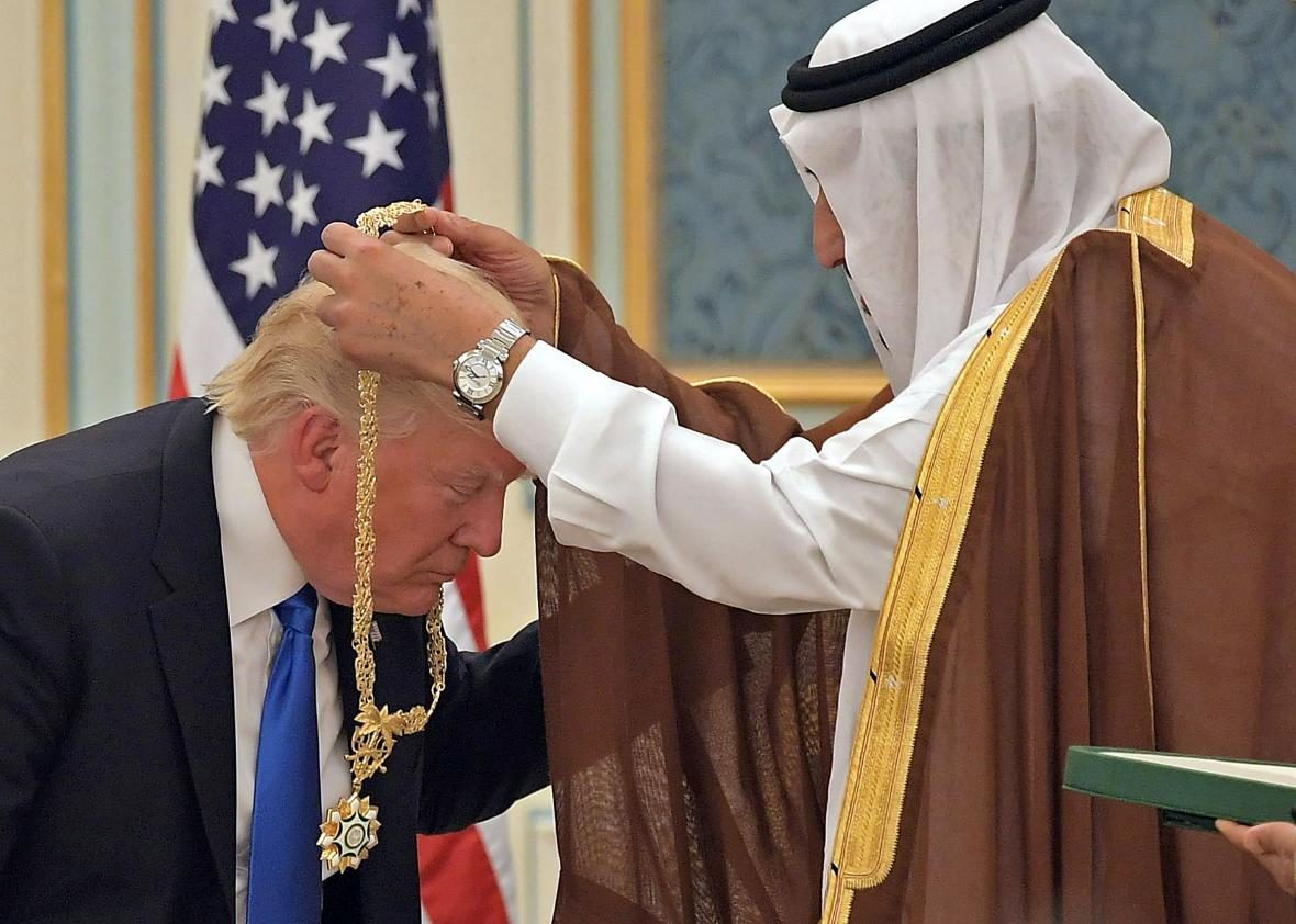 President Donald Trump receives the Order of Abdulaziz al-Saud medal from Saudi Arabia's King Salman bin Abdulaziz al-Saud 