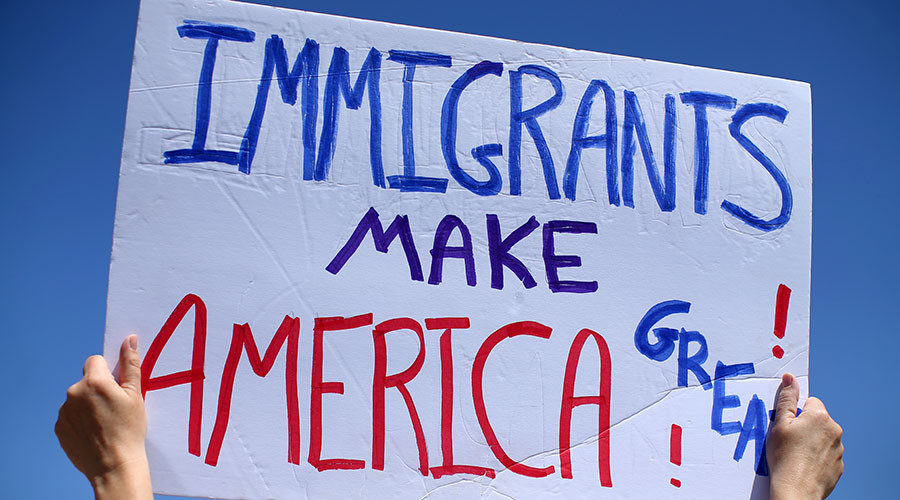 Click to enlarge protester sign on immigration
