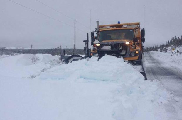 Snow plows out clearing a path in Conche