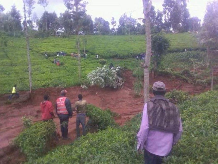 Residents in Kanyakiri village, Embu North subcounty watch as a mudslide destroys farms and vegetation, May 20, 2017. 