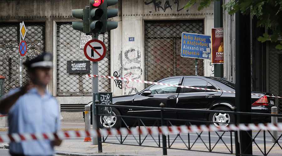 Lucas Papademos suffered burns to his hands and legs in a bomb attack in his car