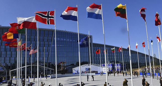 Flags of NATO member countries flutter during a handover ceremony at the NATO summit in Brussels on Thursday, May 25, 2017