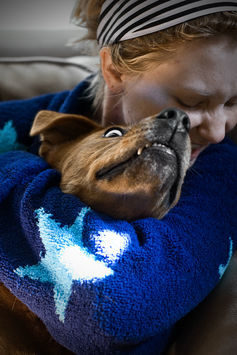 Click to enlarge hugging a dog