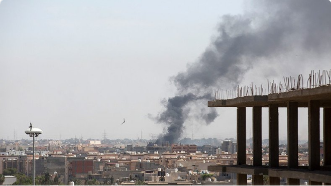 Smoke rises after clashes between National Reconciliation Government of Libya and National Liberation Government in Tripoli, Libya on May 26, 2017
