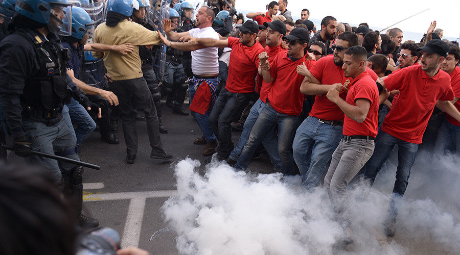 G7 Italy protests riot tear gas