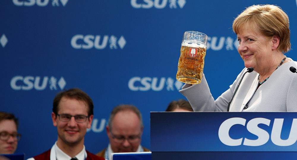 Click to enlarge Angela Merkel drinking beer