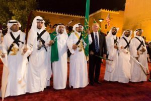 Donald Trump poses for photos with ceremonial swordsmen